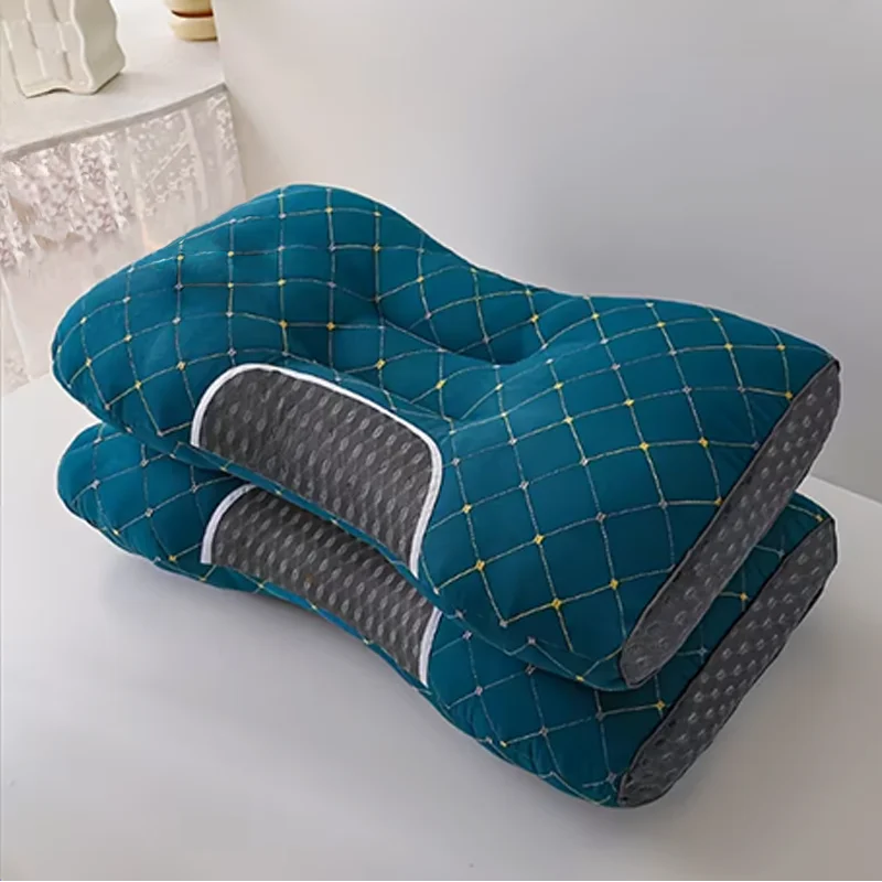 Teal and gray pillow on a white surface