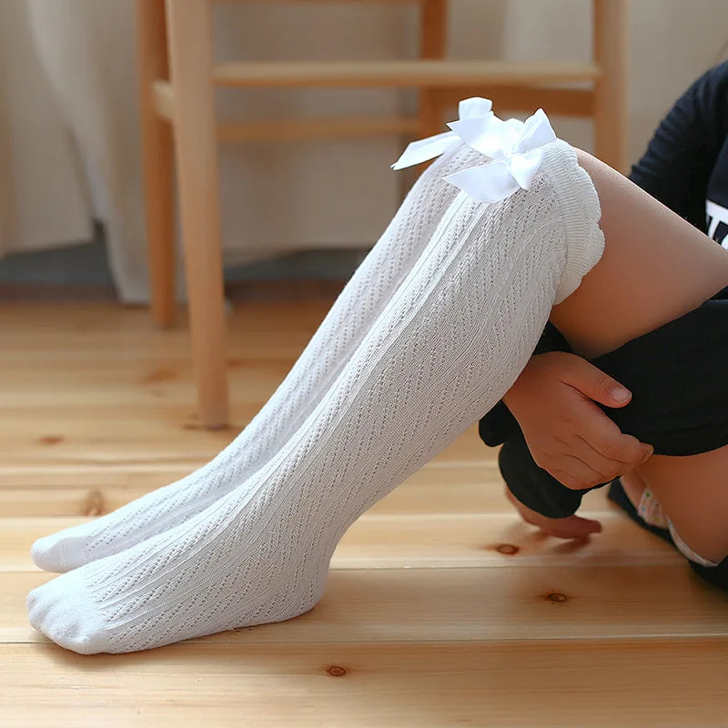 Girls’ Knee-High Bow Cartoon Socks — Ages 2–12