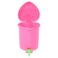 Pink strawberry mini trash can with its hinged lid open and a green front pedal