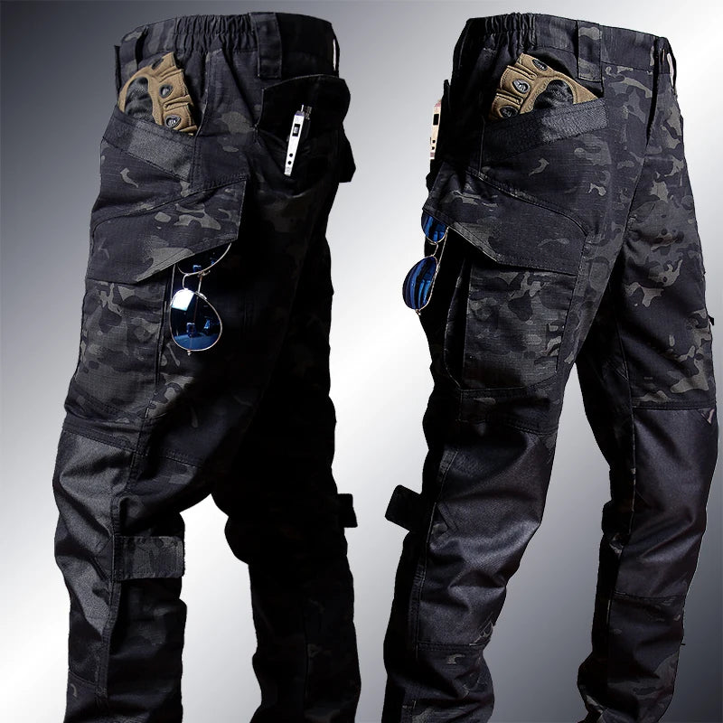 Camouflage pants shown from front and back on a gray background
