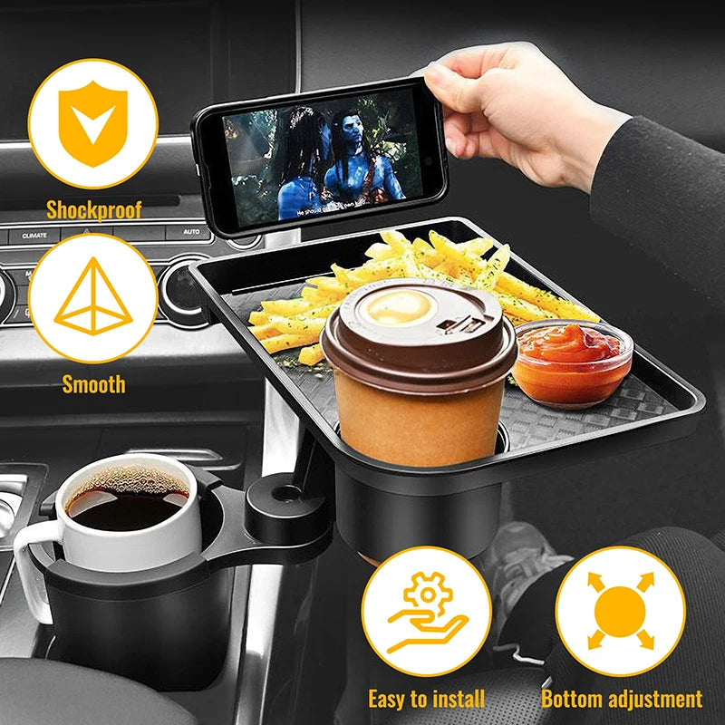A black car cup holder tray organizer mounted on a car console, holding a coffee cup, fries, a takeaway coffee lid, and a phone. A hand is holding the phone, and the image includes feature icons and text for shockproof, smooth, easy to install, and bottom adjustment.