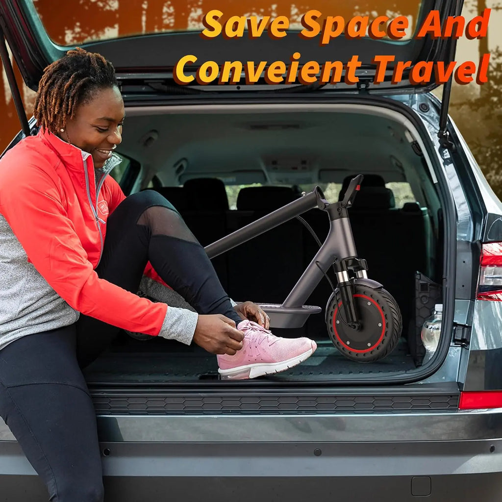 Foldable electric scooter stored in the back of an SUV for convenient travel.