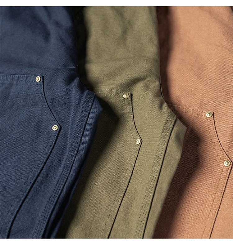 Three close-up views of textured canvas button-up shirts in navy blue, olive green, and tan, showing the fabric texture, pocket seams, and brass snap buttons.
