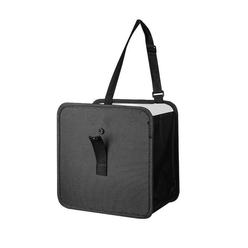 A black canvas utility bag with a top handle, zippered side pocket, and a front hook-and-loop strap closure, shown on a plain white background.