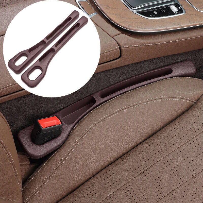 A brown plastic car seatbelt release latch accessory shown installed in a car interior, with a circular inset showing the pair of latch pieces.