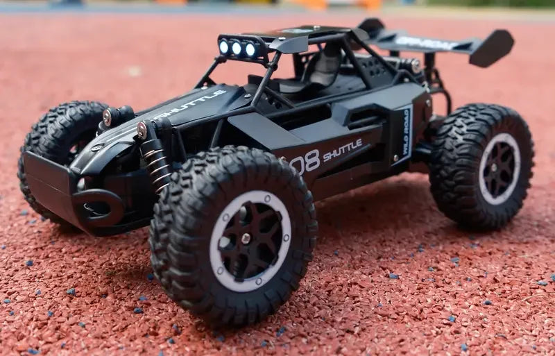 Black remote control car on a red track