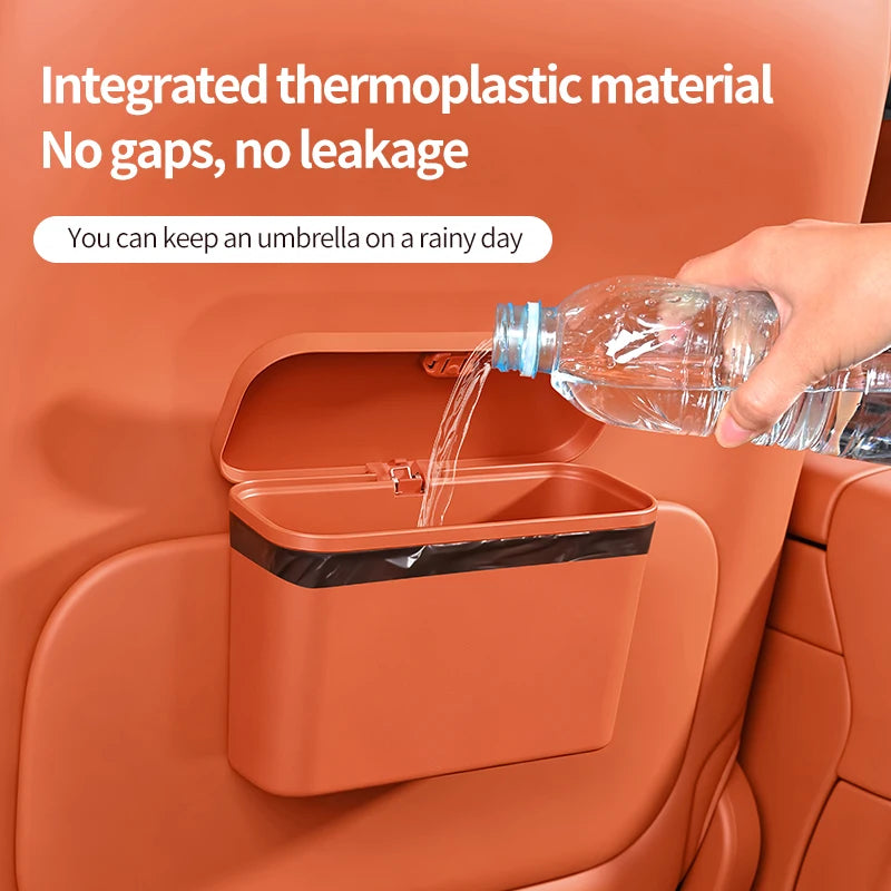 Orange car trash can with water being poured into it, text about thermoplastic material and leakage prevention.