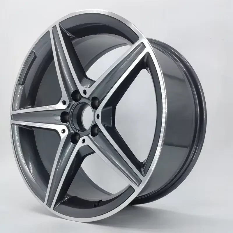 A multi-spoke alloy car wheel rim with a dark gray and silver metallic finish, shown at an angle on a light gray background.