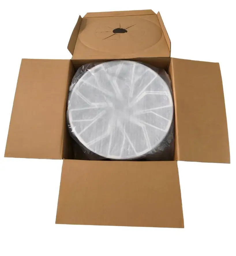 A round white plastic or resin component wrapped in clear protective plastic, displayed inside an open brown cardboard box on a plain white background.