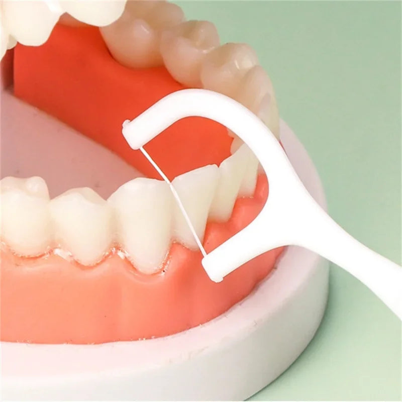 Clean Between Every Tooth. — Portable Disposable Dental Floss Picks | High-Tension Floss Sticks, 50pcs per Box, 1, 2, 3, 5 & 10 Box Options