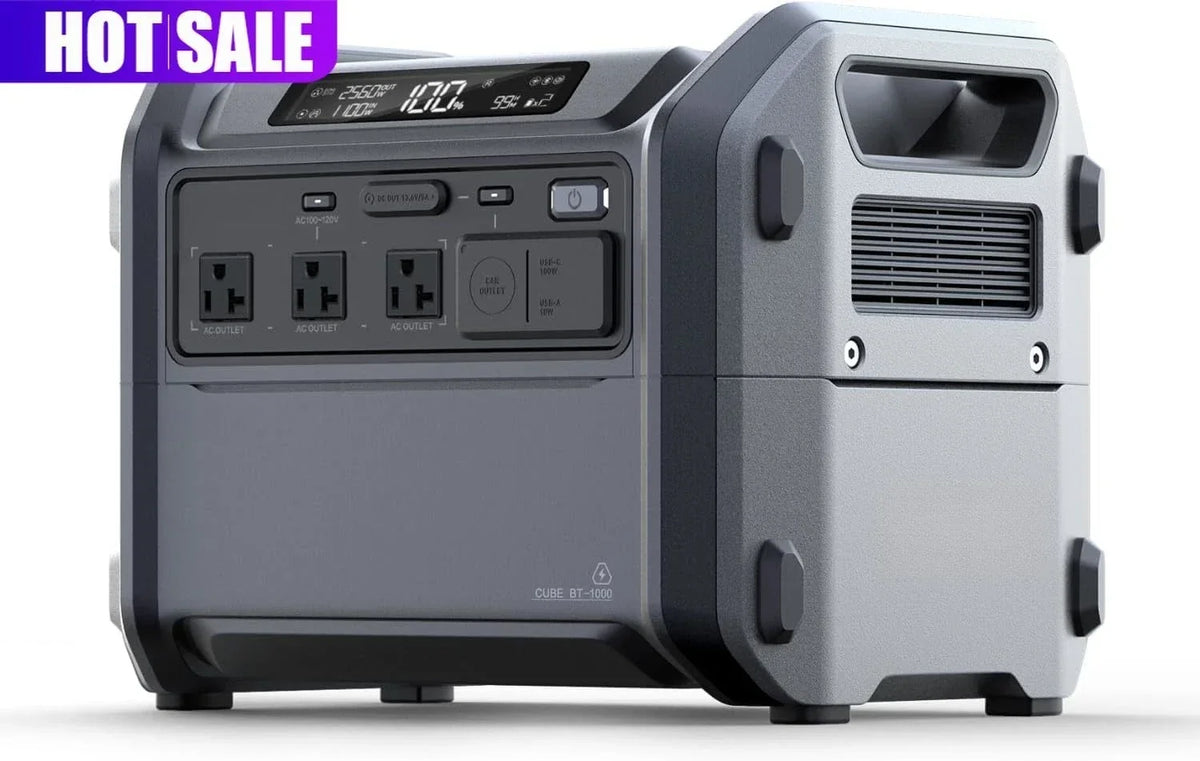 Grey Cube 1000 modular power station showing AC outlets, upper display, and side carry handle