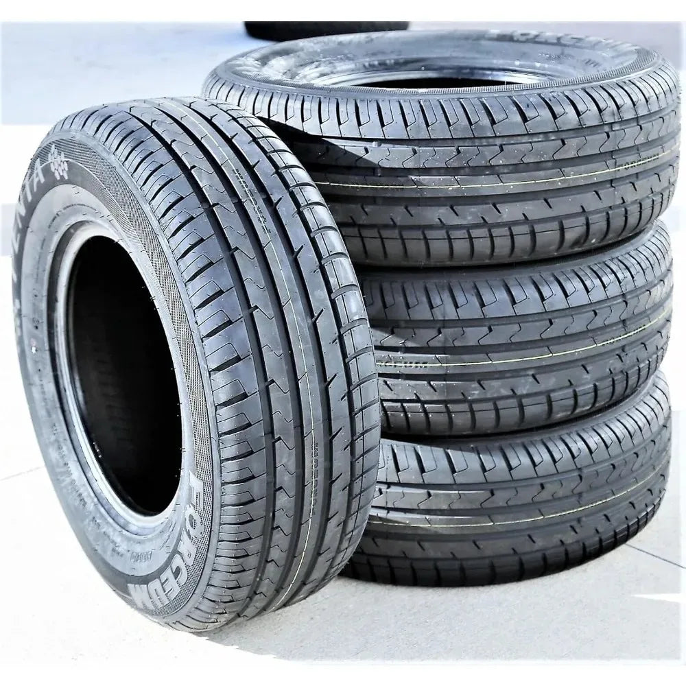 Set of tires with visible tread patterns on a light background