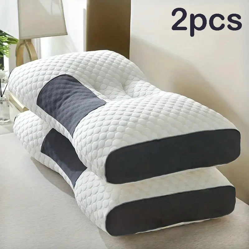 Two white and black ergonomic pillows on a light surface with '2pcs' text above.