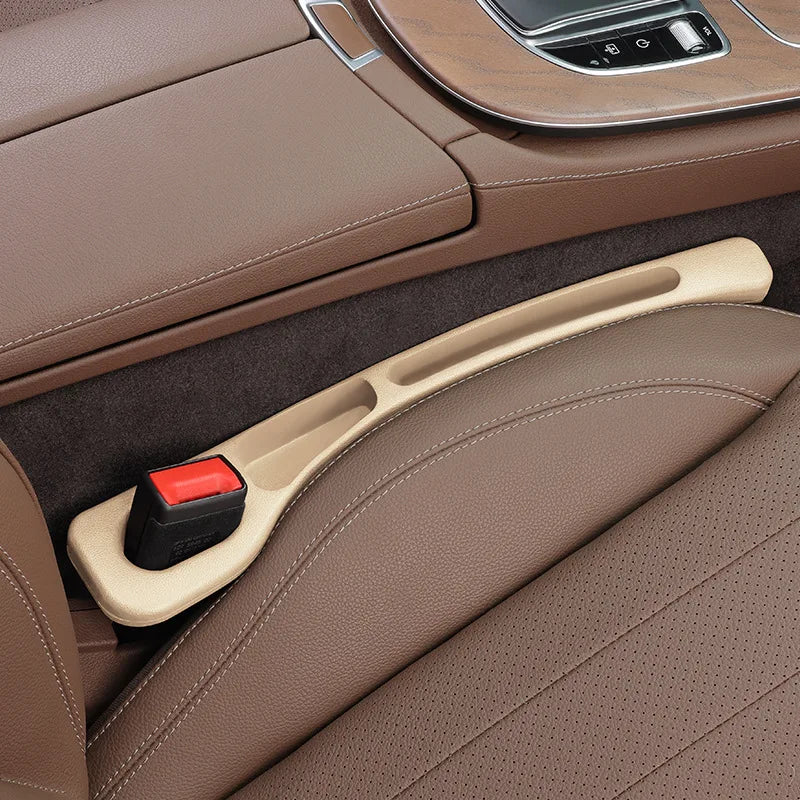 Close-up of a car's brown interior with a handbrake and gear shift.