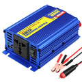 A blue aluminum power inverter with a yellow and red label, shown on a white background with attached red and black battery clamps.