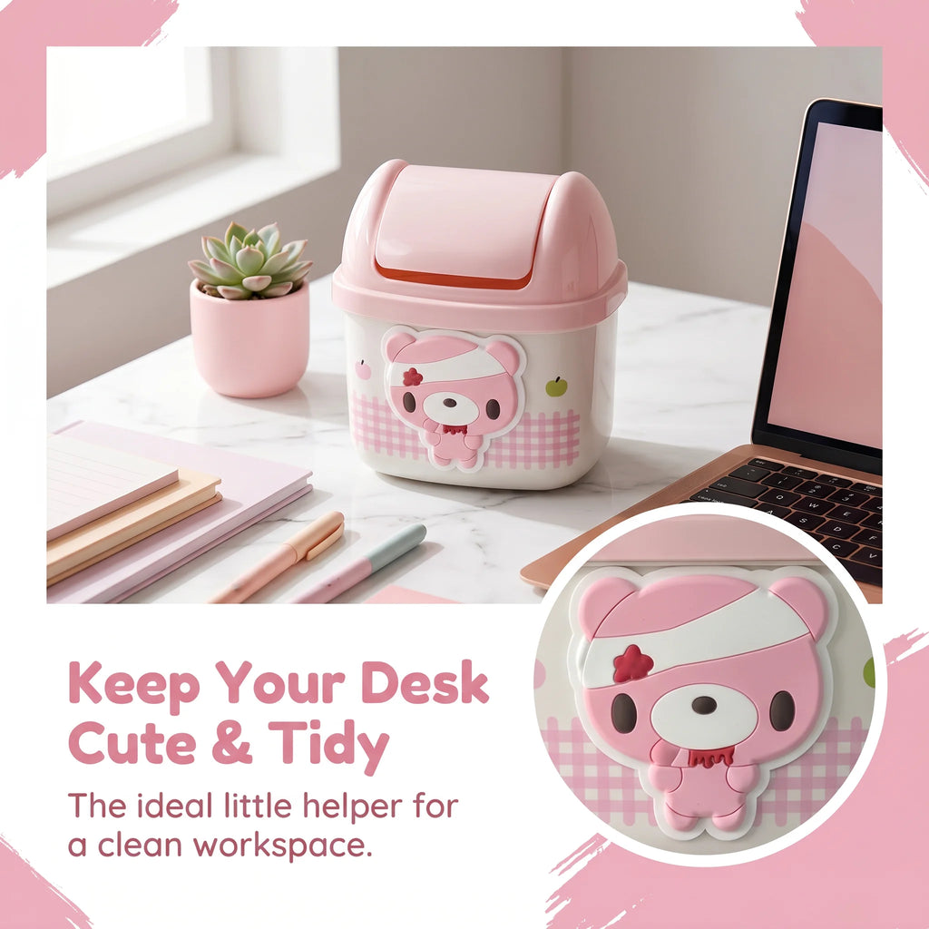 Pink bear mini desktop trash can with a rolling lid beside a laptop and stationery
