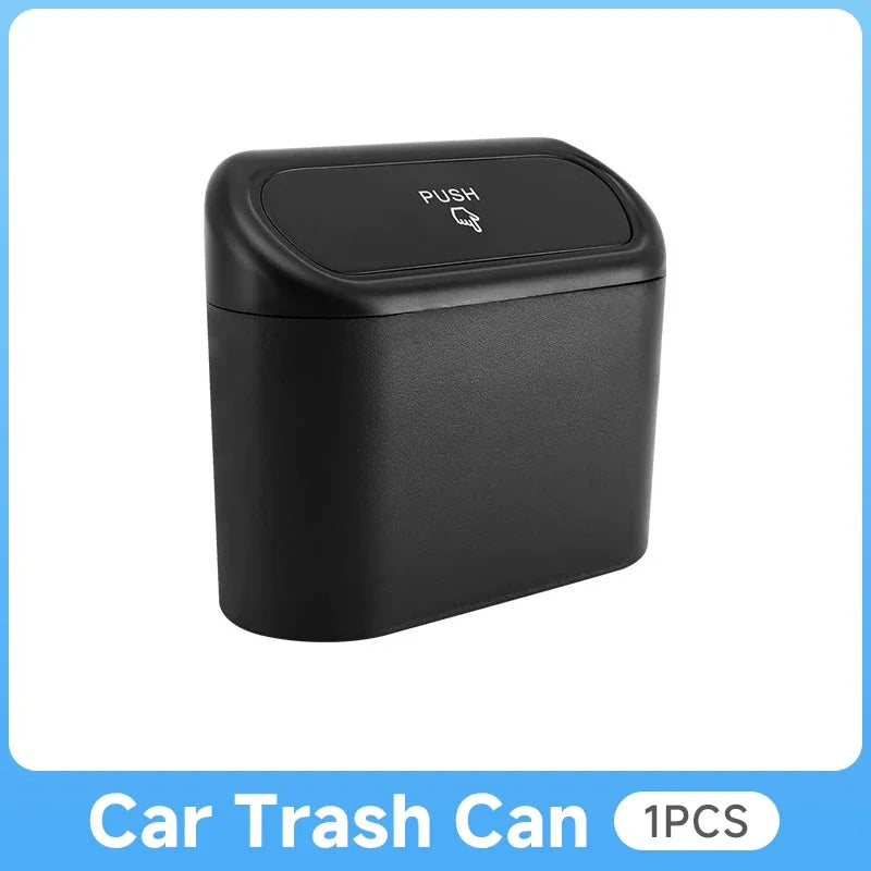 Black car trash can with push lid on a white background