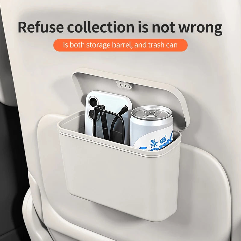 Small storage barrel with a can and phone inside, attached to a car's side panel.