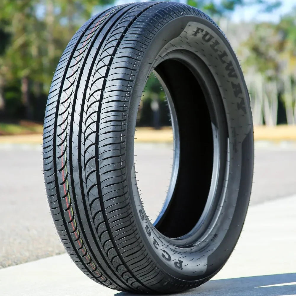 Car tire with visible branding on a blurred outdoor background