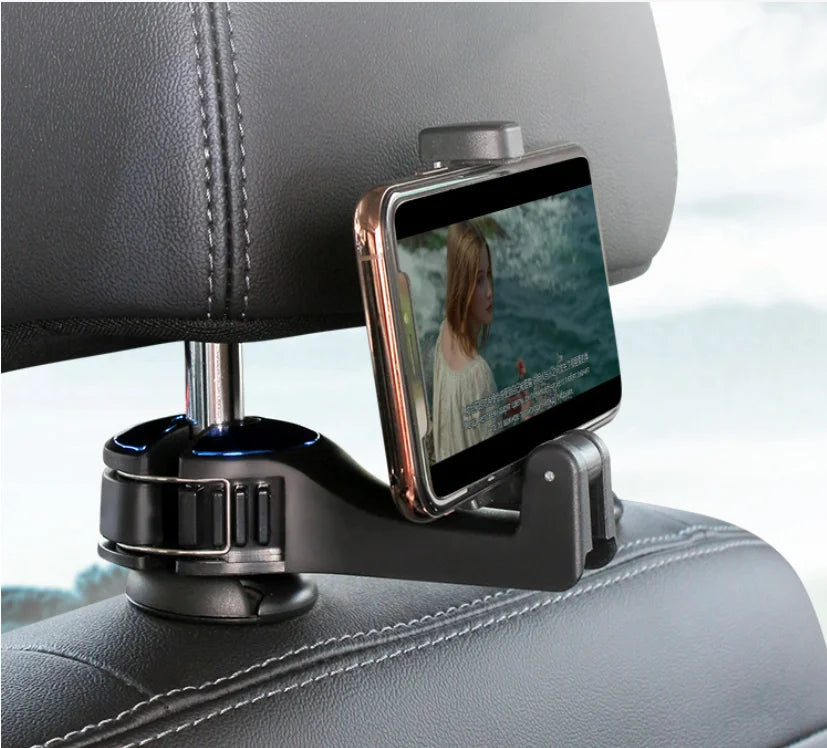 Phone mount on a car headrest with a phone displaying a video.