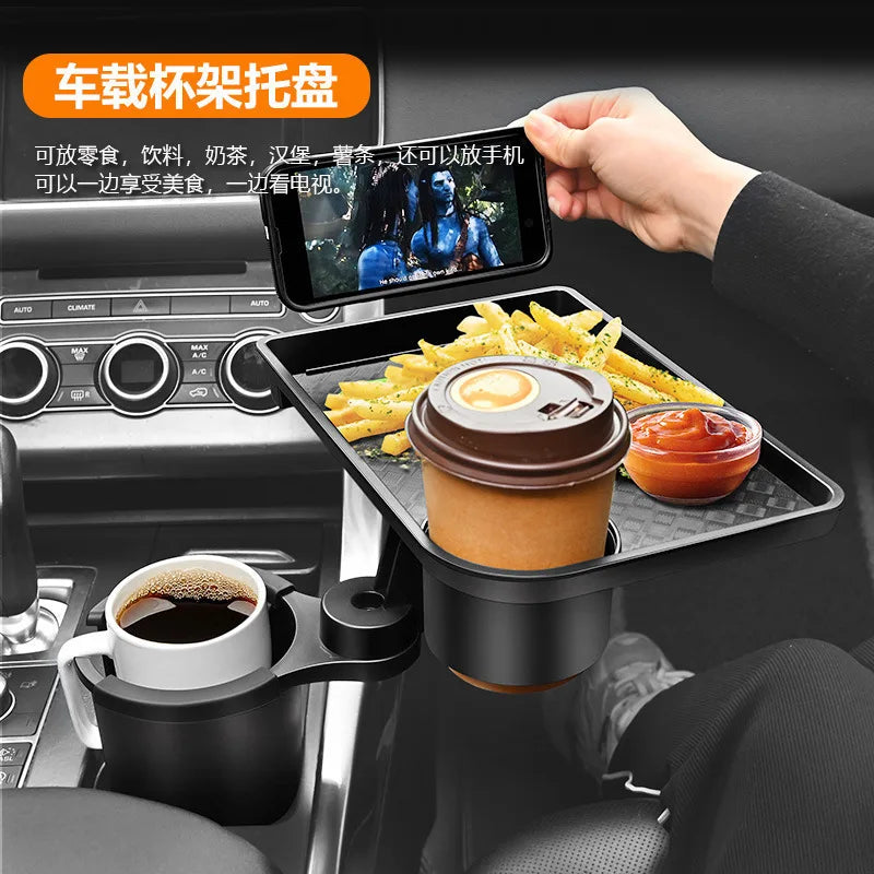 Car cup holder tray with phone stand, coffee, fries, and ketchup in a car interior.
