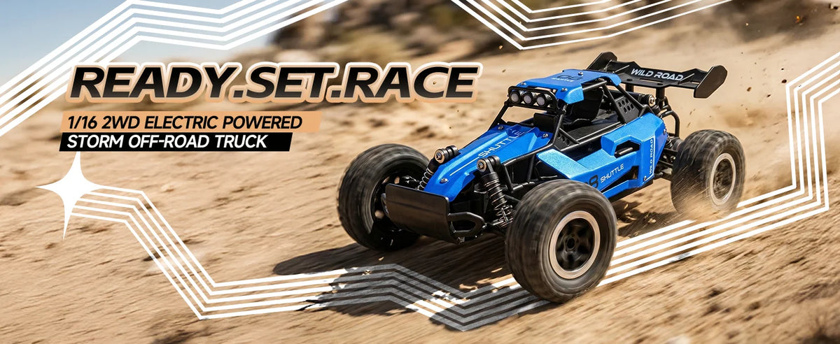 A blue 1/16 scale electric off-road truck racing on a sandy desert track, with graphic overlays reading 'READY.SET.
