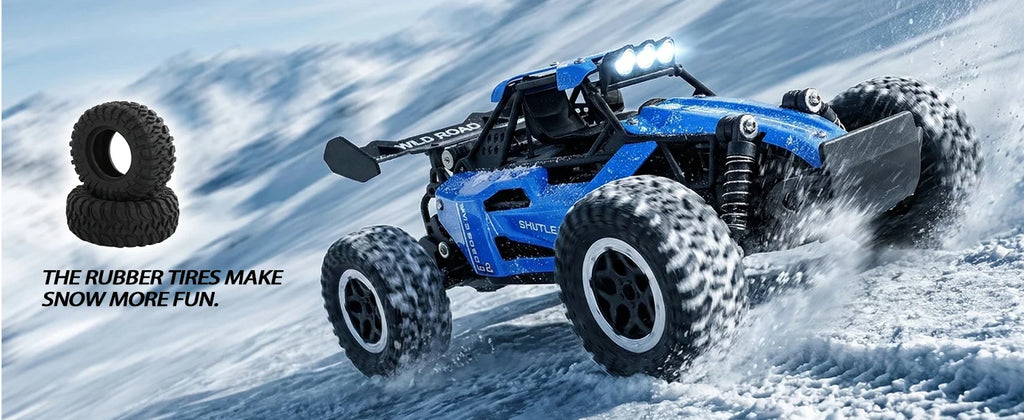 A blue remote control snowmobile with large black off-road tires driving through snow, with two black tires shown in the upper left and the text 'THE RUBBER TIRES MAKE SNOW MORE FUN.'.