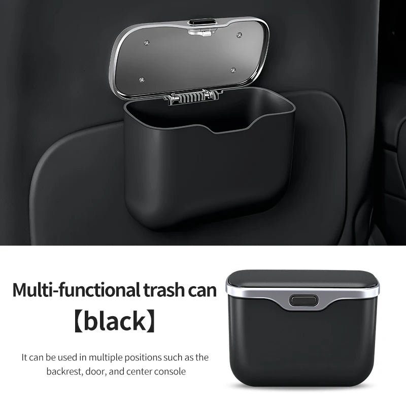 Black multi-functional trash can with silver lid attached to a car seat.