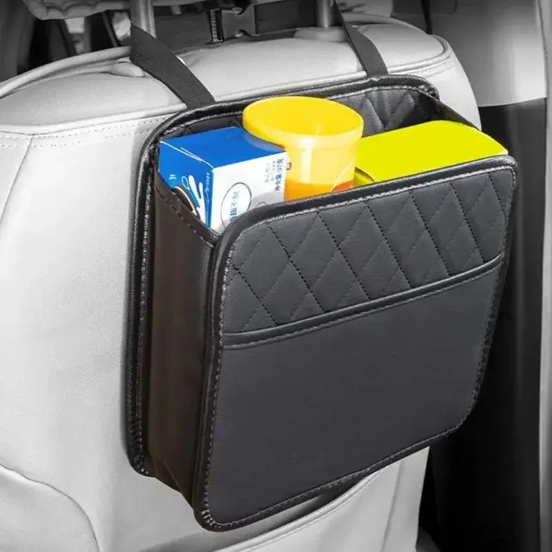 Car seat organizer with items inside attached to a car seat.