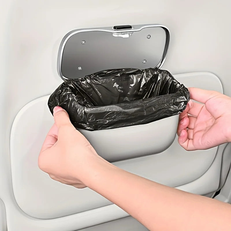 Car trash bin with a black plastic bag