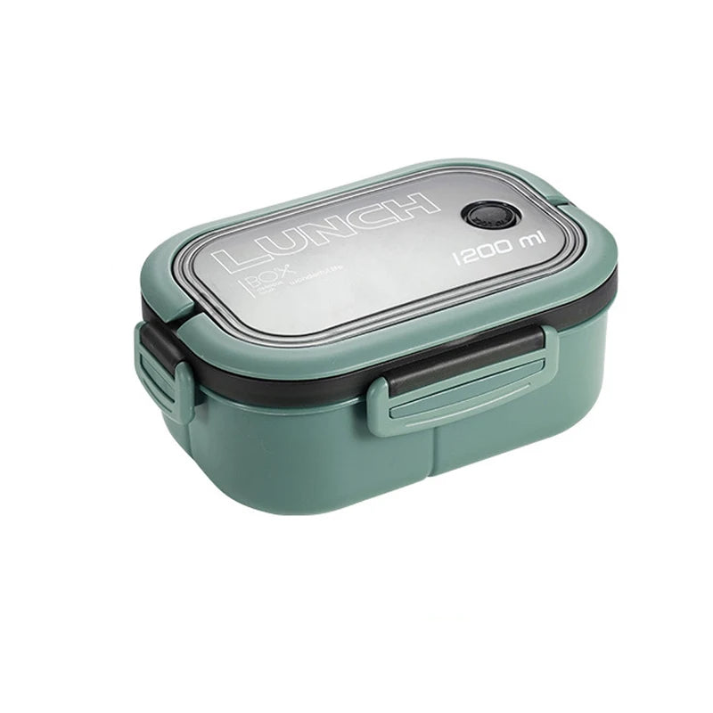 Green lunch box with a gray lid on a white background