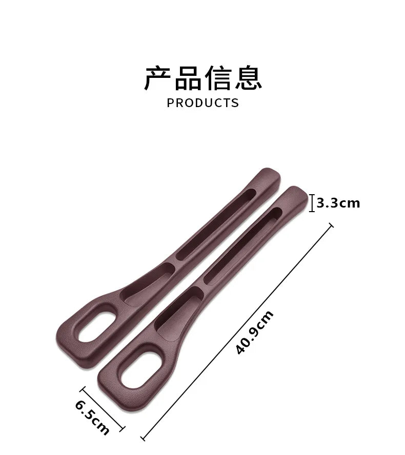 Two brown plastic straps with measurements on a white background