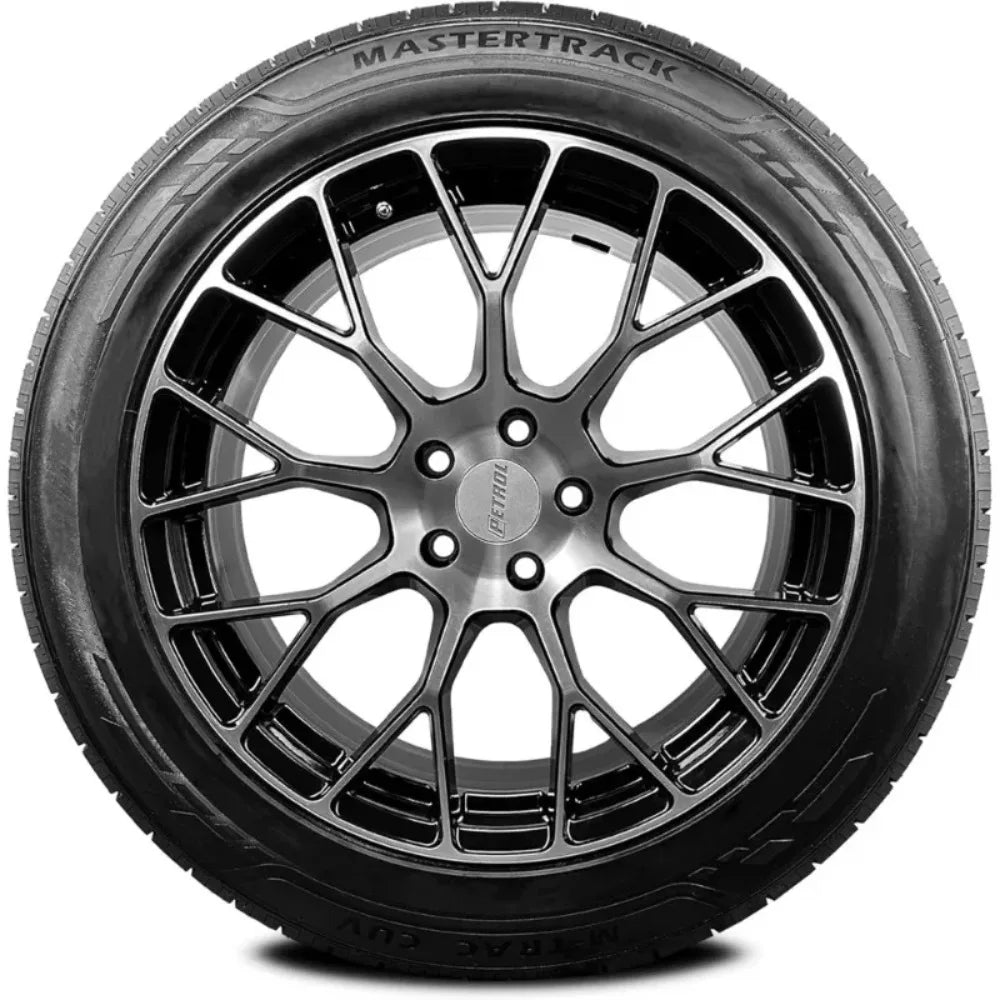 A black MasterTrack tire mounted on a dark metallic multi-spoke wheel, shown against a plain white background.