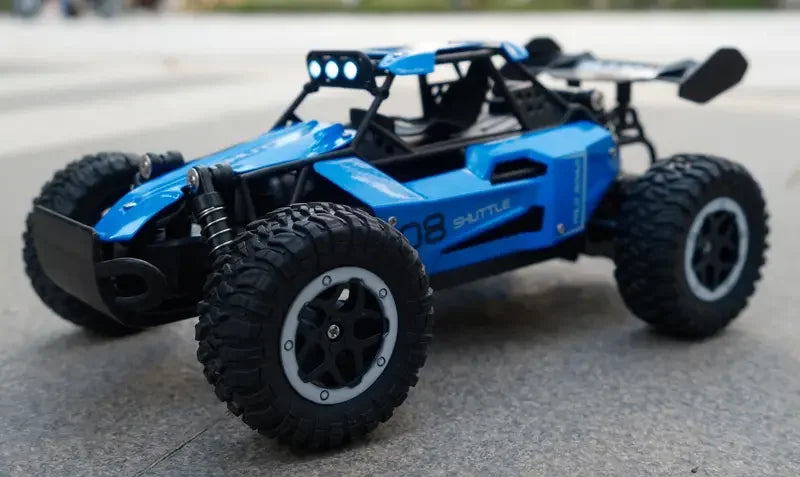 Blue off-road toy vehicle on a road